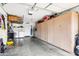 Spacious garage with built-in storage cabinets and a clean, epoxy floor at 34 Leisure World --, Mesa, AZ 85206