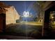 Exterior of a home at night featuring a community globe, greenery, and architectural details at 34 Leisure World --, Mesa, AZ 85206