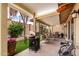 A covered patio with artificial turf, an outdoor kitchen, and patio furniture at 34 Leisure World --, Mesa, AZ 85206