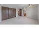 Spacious bedroom features neutral carpet, fan, closet, and ensuite bathroom at 3407 E Pueblo Ave, Mesa, AZ 85204