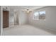 Bright carpeted bedroom with a large window and view of the neighborhood at 3407 E Pueblo Ave, Mesa, AZ 85204