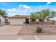 Charming single-story home featuring a two-car garage and low maintenance desert landscaping at 3407 E Pueblo Ave, Mesa, AZ 85204