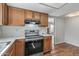 Functional kitchen featuring updated appliances, plenty of counter space, and natural wood cabinetry at 3407 E Pueblo Ave, Mesa, AZ 85204