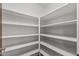 This is a large pantry with floor to ceiling shelving, providing ample storage space at 3407 E Pueblo Ave, Mesa, AZ 85204