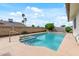 Backyard with a pristine swimming pool and well-maintained landscaping at 3407 E Pueblo Ave, Mesa, AZ 85204