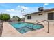 Backyard swimming pool and spa with clear blue water at 3407 E Pueblo Ave, Mesa, AZ 85204