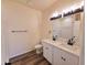 Bright bathroom featuring double sinks, white cabinets, and modern fixtures at 350 N Florence St, Florence, AZ 85132
