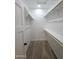 Walk-in closet with built-in shelving, and carpeting to store clothes and shoes at 350 N Florence St, Florence, AZ 85132