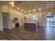 Bright, open kitchen with white cabinets, stainless steel appliances, and a large center island at 350 N Florence St, Florence, AZ 85132