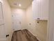 Functional laundry room with cabinets and ample space at 350 N Florence St, Florence, AZ 85132