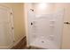 New shower includes built in shelving and a modern shower head at 350 N Florence St, Florence, AZ 85132