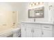 Recently renovated bathroom features a shower-tub combo and a vanity with white cabinets at 3556 E Angela Dr, Phoenix, AZ 85032