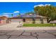 Charming single-Gathering home with solar panels, green lawn, and a two-car garage at 3556 E Angela Dr, Phoenix, AZ 85032