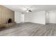 Spacious living room with gray floors, neutral walls, and a brick fireplace at 3556 E Angela Dr, Phoenix, AZ 85032
