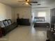Spacious living room that flows into the bedroom with large windows at 3806 N 80Th Dr, Phoenix, AZ 85033