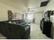 Comfortable living room featuring a large sectional sofa, ceiling fan, and door to the exterior at 3806 N 80Th Dr, Phoenix, AZ 85033