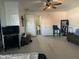 This is a large living room area with views into the bathroom at 3806 N 80Th Dr, Phoenix, AZ 85033