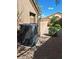 Backyard with an air conditioning unit and low-maintenance landscaping at 4202 E Broadway Rd # 40, Mesa, AZ 85206