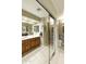 Accessible bathroom with double sink vanity, large mirror, and safety bars at 4202 E Broadway Rd # 40, Mesa, AZ 85206