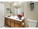 Well-lit bathroom featuring a double sink vanity, large mirror, and a convenient towel rack at 4202 E Broadway Rd # 40, Mesa, AZ 85206