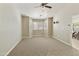 Spacious bedroom with a large window, neutral walls, carpeting, and TV mount ready for your personal touch at 4202 E Broadway Rd # 40, Mesa, AZ 85206