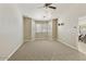 Neutral bedroom featuring carpet, large windows, and a view into dining room at 4202 E Broadway Rd # 40, Mesa, AZ 85206