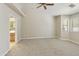 Expansive bedroom with plush carpeting, lots of light, and a doorway leading into the ensuite bathroom at 4202 E Broadway Rd # 40, Mesa, AZ 85206
