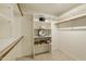Walk-in closet featuring built-in shelving and ample storage space at 4202 E Broadway Rd # 40, Mesa, AZ 85206