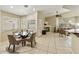 Bright dining area with a glass table, tile flooring, natural light, and open-concept design at 4202 E Broadway Rd # 40, Mesa, AZ 85206