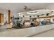 Bright dining hall with skylight, ceiling fan, and numerous tables and chairs at 4202 E Broadway Rd # 40, Mesa, AZ 85206