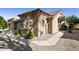 Beautiful home exterior featuring desert landscaping, tile roof, and attached two-car garage at 4202 E Broadway Rd # 40, Mesa, AZ 85206