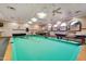 Game room with multiple billiard tables, overhead lighting, and comfortable seating at 4202 E Broadway Rd # 40, Mesa, AZ 85206