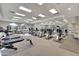Well-equipped gym with treadmills, elliptical machines, stationary bikes, and mirrored wall at 4202 E Broadway Rd # 40, Mesa, AZ 85206
