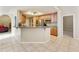 Open kitchen featuring wood cabinets, an island with bar seating, and stainless steel appliances at 4202 E Broadway Rd # 40, Mesa, AZ 85206