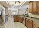 Bright and modern kitchen with stainless steel appliances, wood cabinetry, and an open design perfect for entertaining at 4202 E Broadway Rd # 40, Mesa, AZ 85206