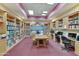 The library has ample shelving, computers, a ceiling fan and a table with comfortable seating at 4202 E Broadway Rd # 40, Mesa, AZ 85206