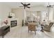 Spacious living room with a fireplace, neutral-toned furniture, tile flooring, and lots of natural light at 4202 E Broadway Rd # 40, Mesa, AZ 85206