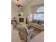 Open-concept living room featuring a fireplace, cozy seating, and a neutral palette at 4202 E Broadway Rd # 40, Mesa, AZ 85206