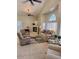 Inviting living room featuring a cozy fireplace, plush seating, and an abundance of natural light at 4202 E Broadway Rd # 40, Mesa, AZ 85206