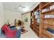 Cozy home office with built-in bookshelves, tile floors, and plenty of storage space at 4202 E Broadway Rd # 40, Mesa, AZ 85206