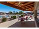 Inviting patio area with comfortable seating, a cozy fireplace, and lush landscaping by the community pool at 4202 E Broadway Rd # 40, Mesa, AZ 85206