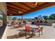 Well-appointed patio area with stylish seating, perfect for outdoor dining, and a charming fireplace at 4202 E Broadway Rd # 40, Mesa, AZ 85206