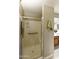 Accessible shower with glass door, grab bars, and built-in seat at 4202 E Broadway Rd # 40, Mesa, AZ 85206