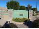 Verde Groves community sign featuring stone pillars, a green sign and well maintained landscaping at 4202 E Broadway Rd # 40, Mesa, AZ 85206