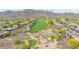 Aerial view of the homes in the golf course community with desert landscaping and mountain views at 42102 N Long Cove Way, Phoenix, AZ 85086