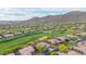 Community aerial view showcases beautiful mountain views, golf course, and lush desert landscaping at 42102 N Long Cove Way, Phoenix, AZ 85086