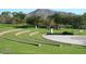 Open green space with tiered seating, perfect for community events and outdoor gatherings at 42102 N Long Cove Way, Phoenix, AZ 85086