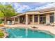 Exterior view of backyard with pool and covered patio featuring multiple seating areas at 42102 N Long Cove Way, Phoenix, AZ 85086