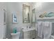 Bathroom featuring a sink vanity, toilet, decorative mirror and towels at 42102 N Long Cove Way, Phoenix, AZ 85086