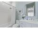 Light and bright bathroom with shower and tub combo, white cabinets, and soft blue accents at 42102 N Long Cove Way, Phoenix, AZ 85086